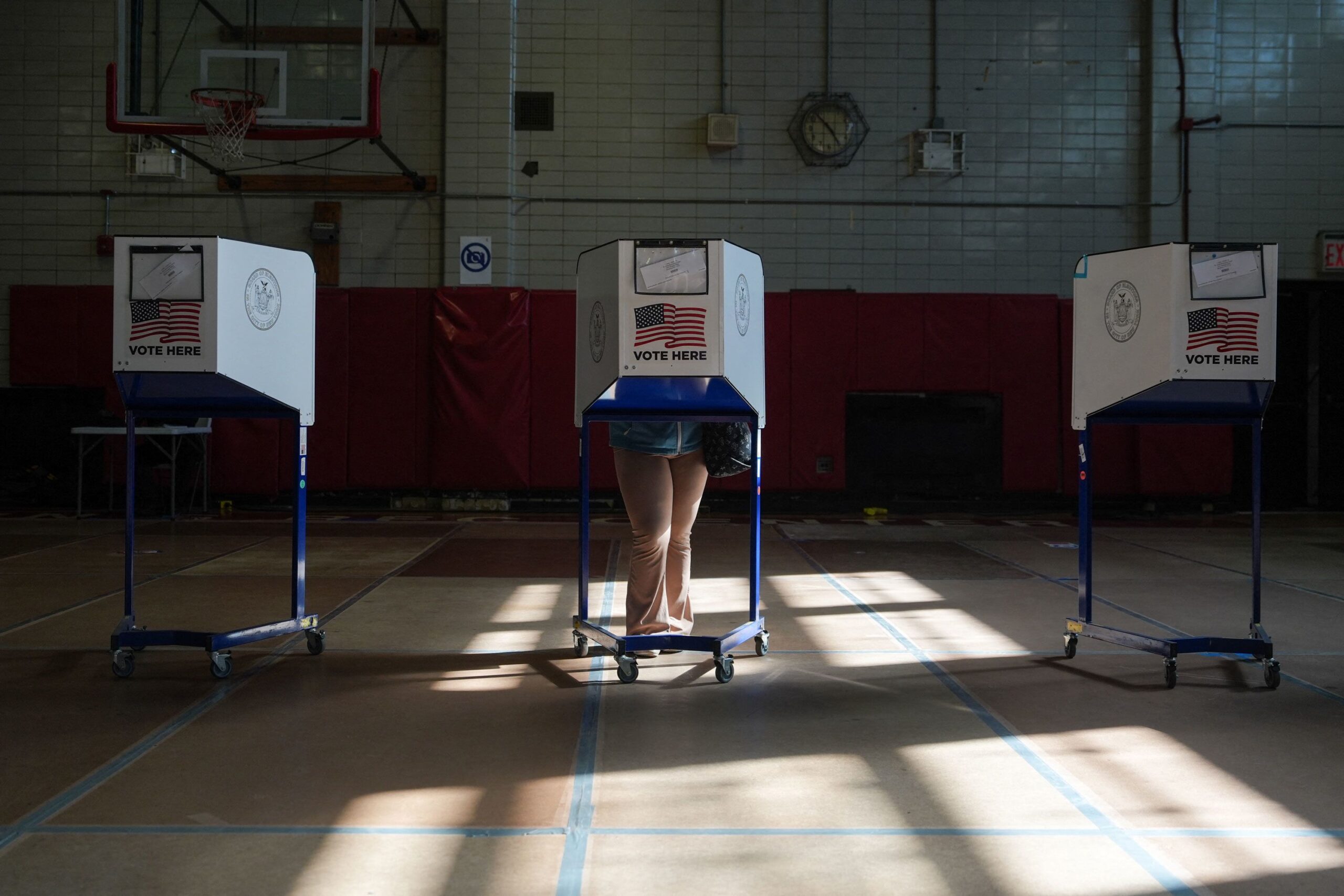 A voter casts their ballot on the first day of early voting for the US midterm elections in the Brooklyn borough of New York City