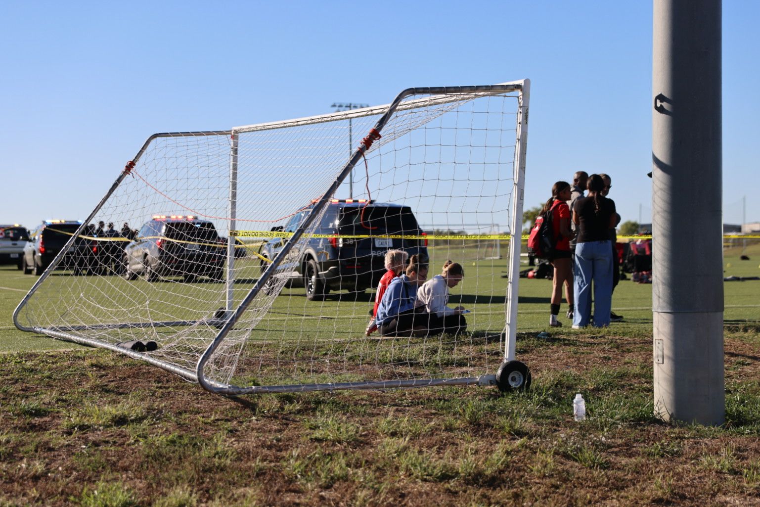 This image provided by KAKE shows police on the scene where a person drove a vehicle through a soccer field during a game in Wichita