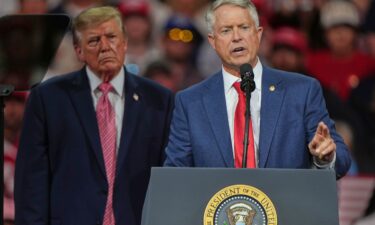President Donald Trump listens as Sen. Roger Marshall speaks at a campaign rally in Park City