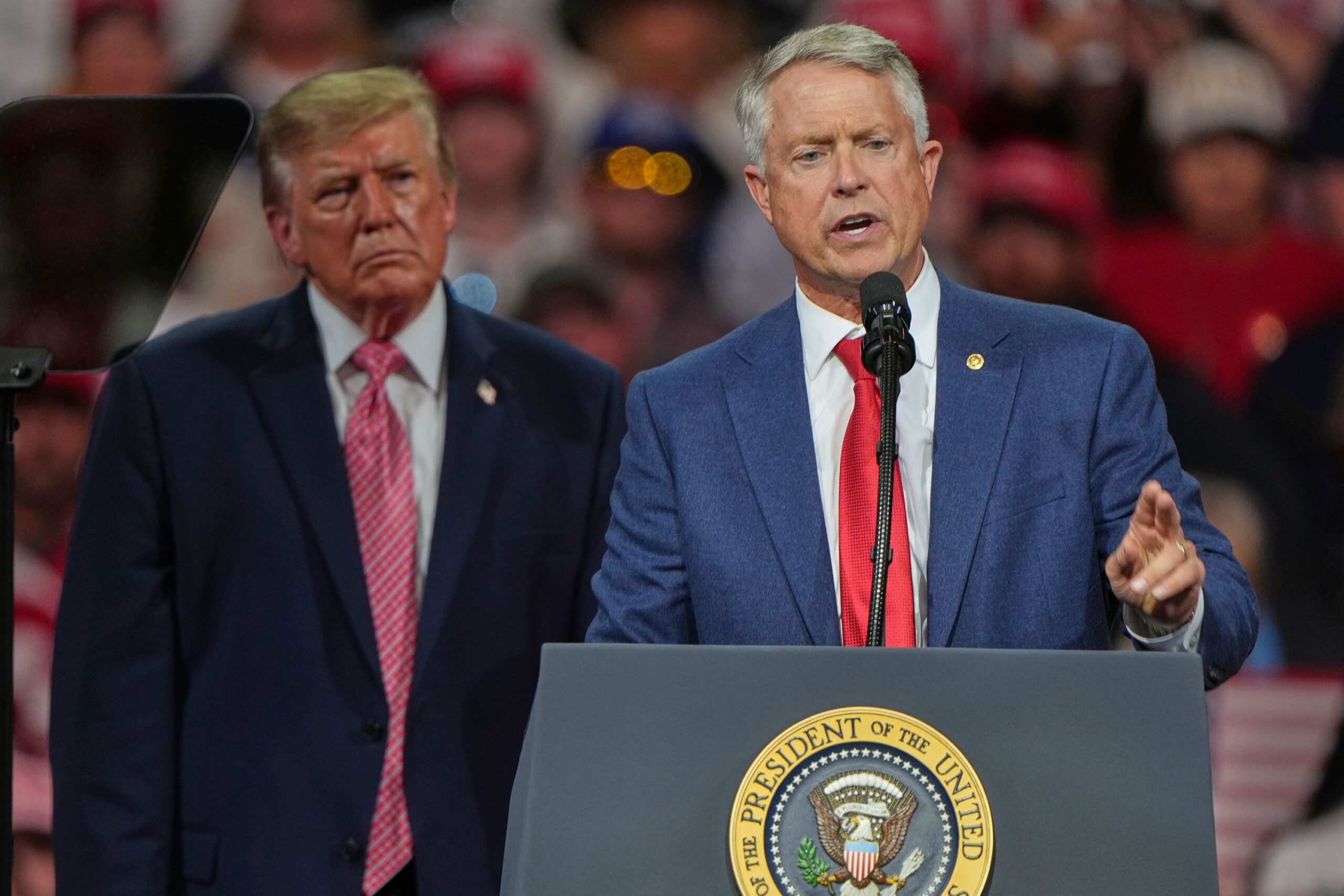 <i>Charlie Riedel/AP via CNN Newsource</i><br/>President Donald Trump listens as Sen. Roger Marshall speaks at a campaign rally in Park City