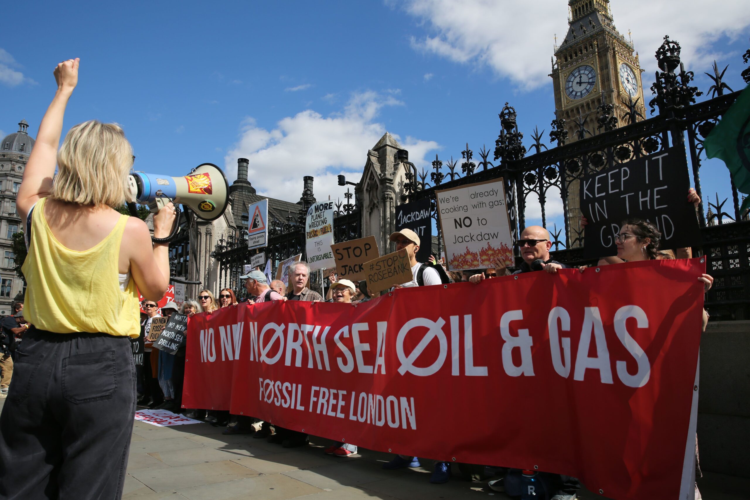 <i>Martin Pope/Getty Images via CNN Newsource</i><br/>Protesters stand behind a banner saying 'No New North Sea Oil And Gas' with signs in London