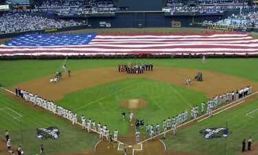 Bush hurls the ceremonial first pitch during Game 3 of the 2001 World Series.