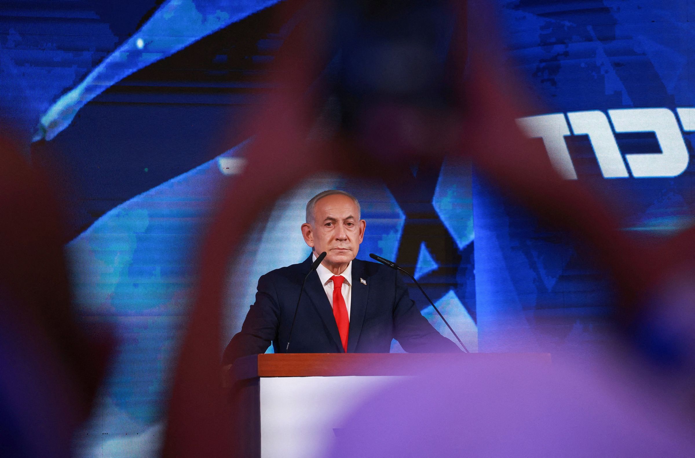 Israeli Prime Minister and Likud party leader Benjamin Netanyahu reacts to exit polls